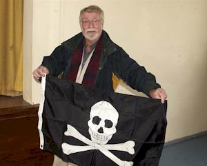 Clarke Pickett holding a pirate flag.