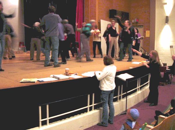 Debbie points to a cast member from the pit