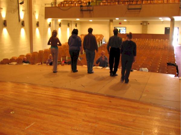 Brian and Debbie direct the cast on stage