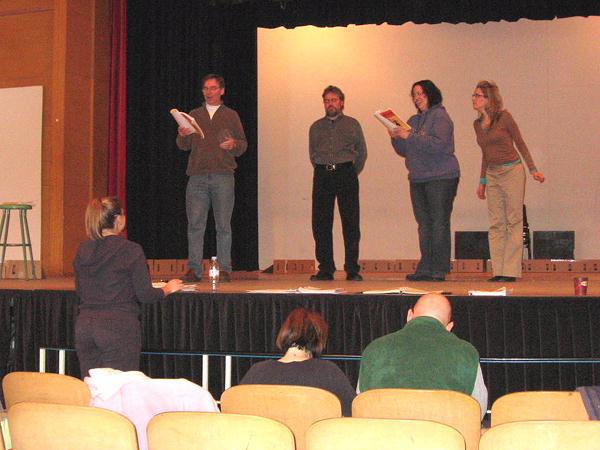 Huw reads his lines while the other leads react.