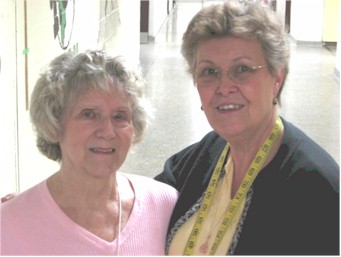 Barb Farrow and Mary Hill in a doorway