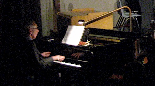 Stan Farrow plays the piano.