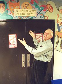 Stan Farrow in front of the auditorium named in his honour
